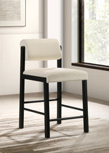 Silla tapizada Kehoe con altura de mostrador en crema y negro (juego de 2)